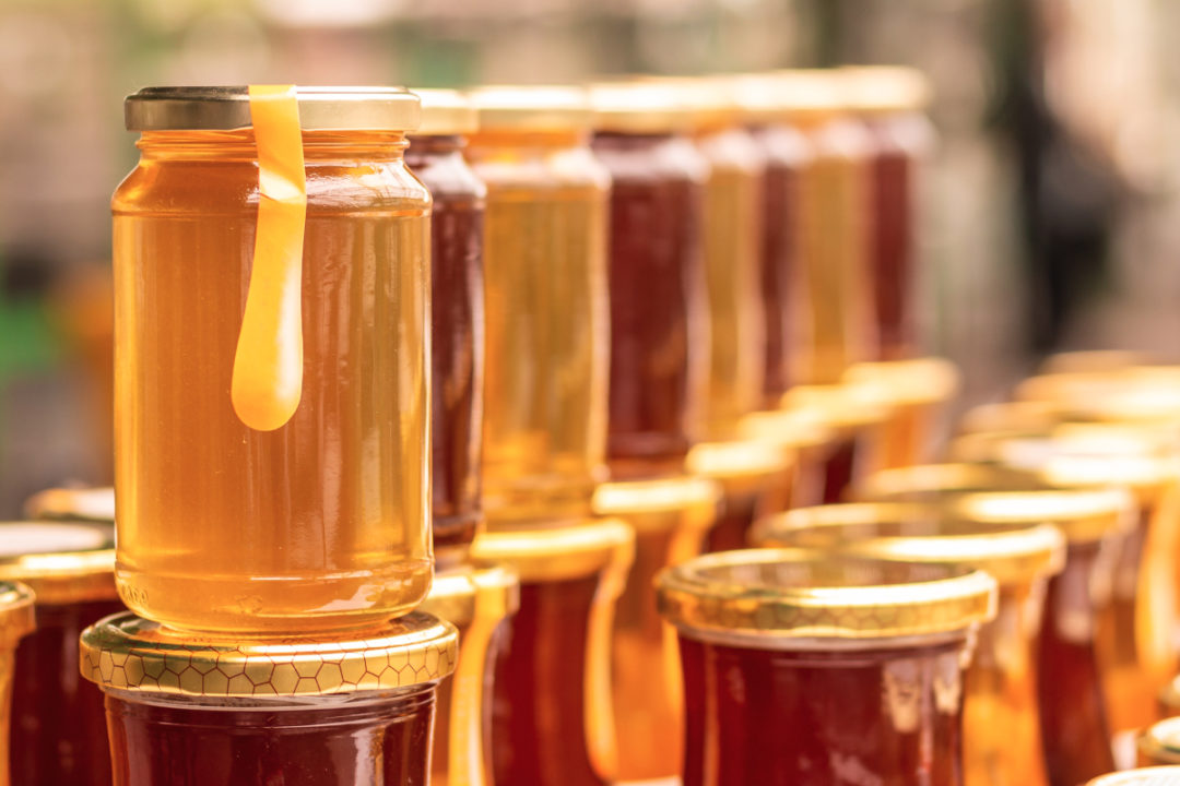 Jars of colorful honey
